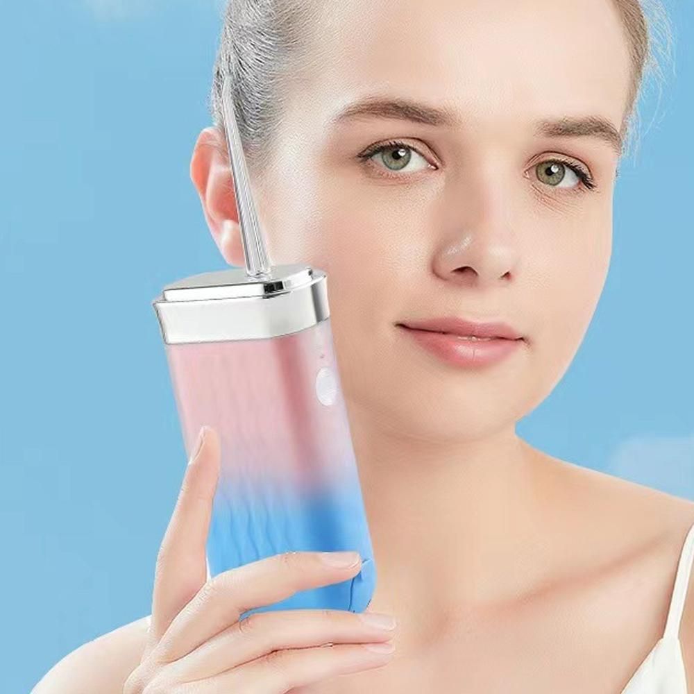 Mini Portable Oral Irrigator Rechargeable Water Dental Flosser With Stretchable Water Tan -Pink